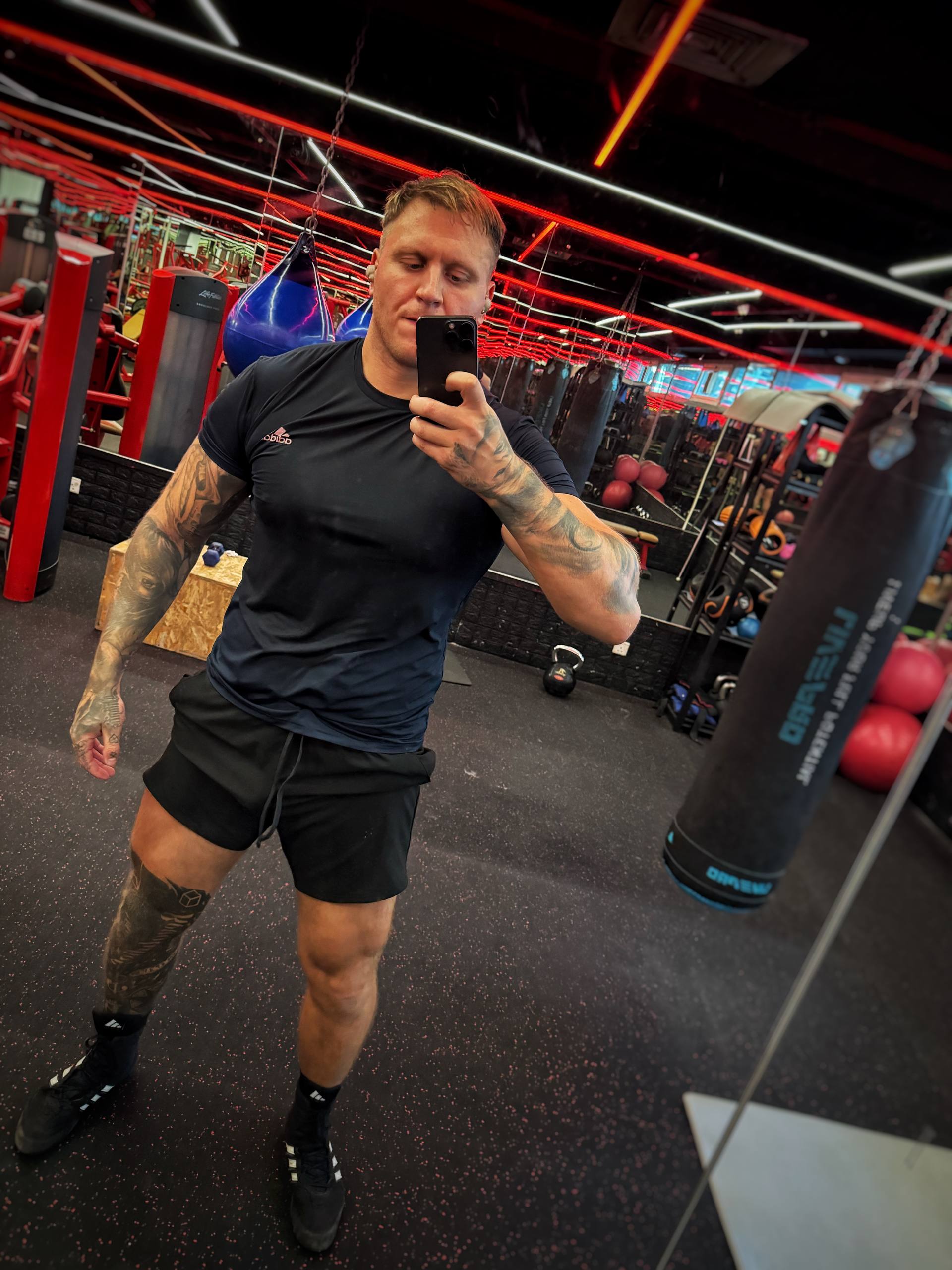 Coach demonstrating training environment and physique in Dubai